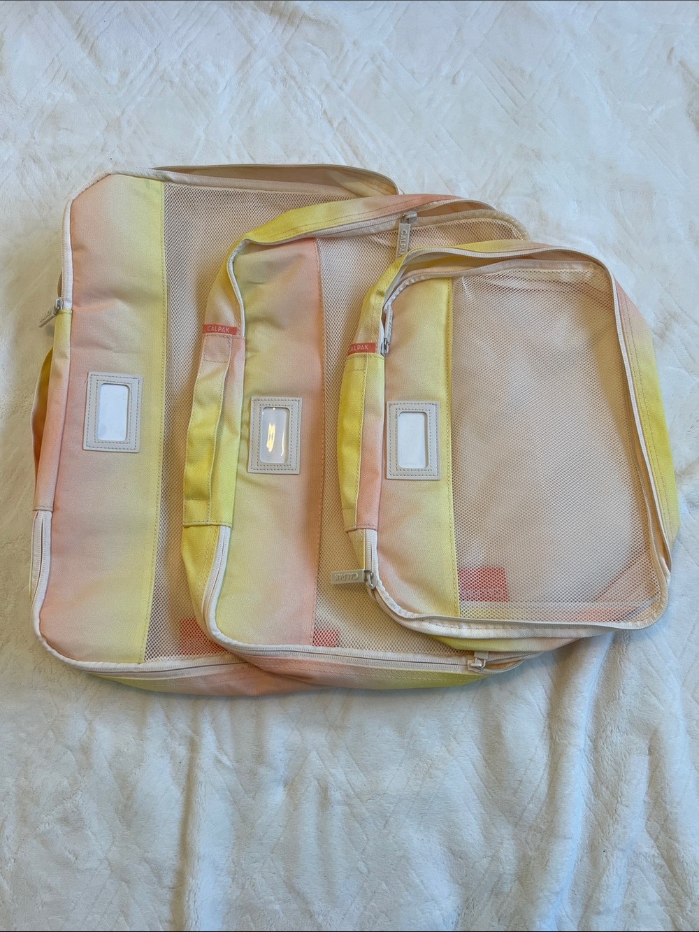 Calpak Gradient Packing Cubes in Yellow and Peach
